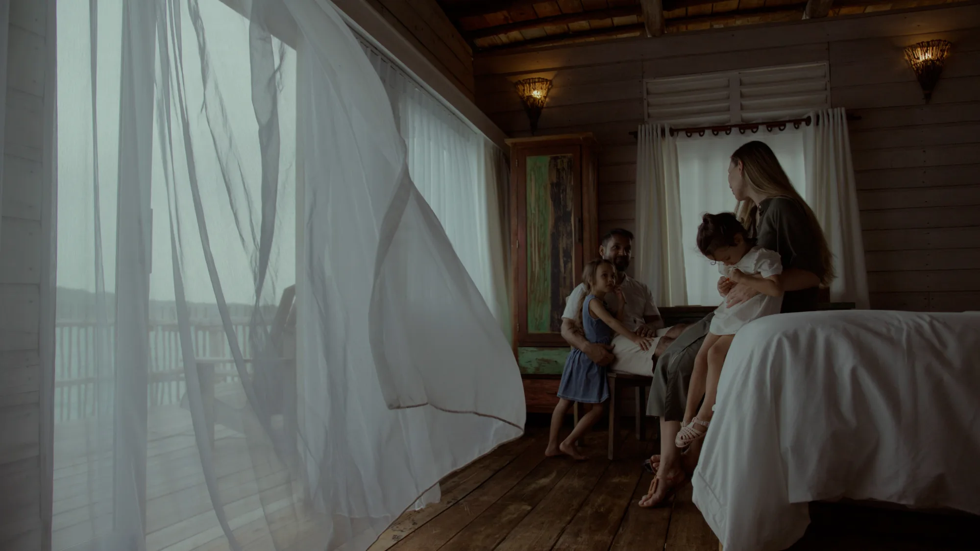 Family inside an Overwater Villa at Telunas Private Island