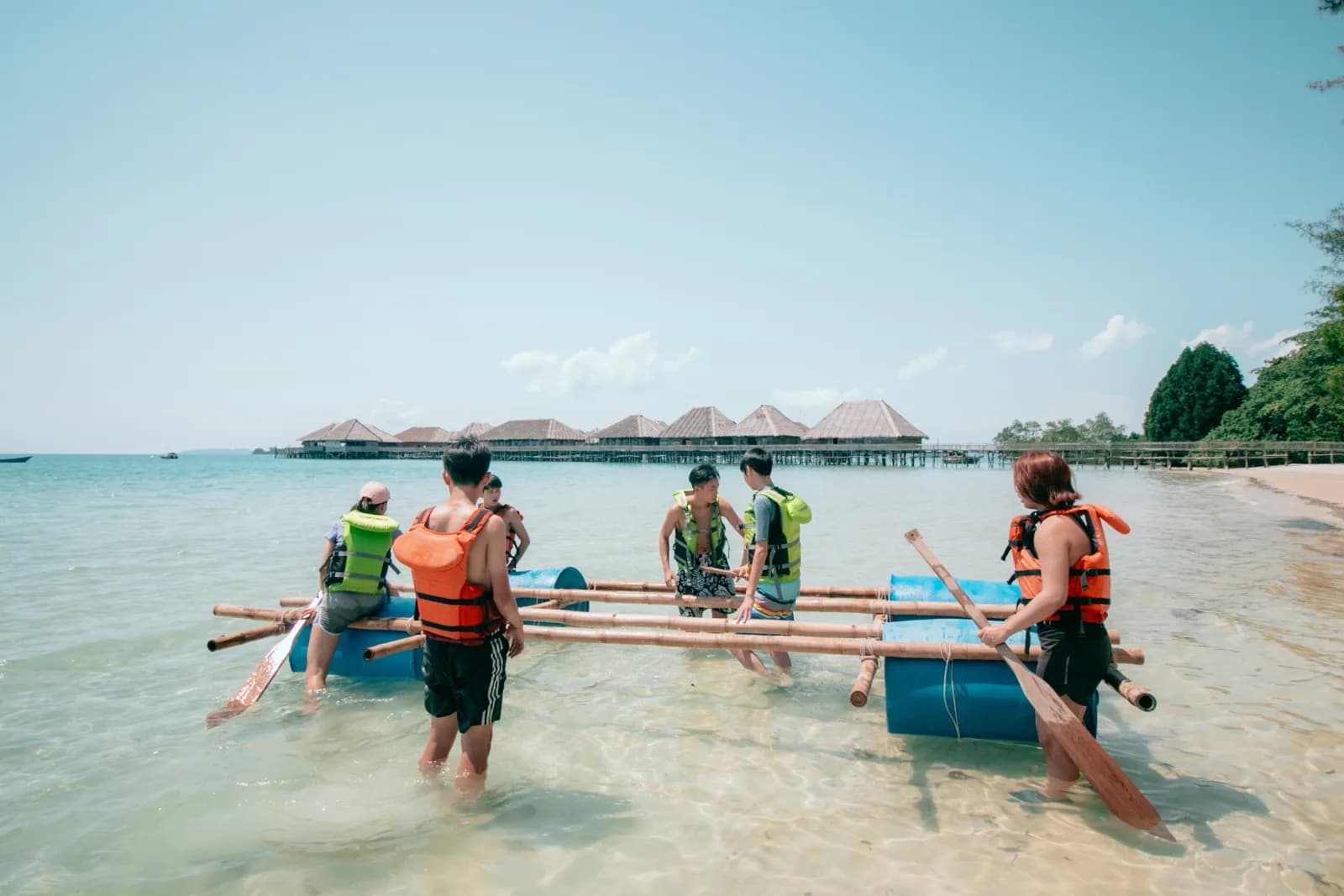 Family raft building on the water at Telunas, an additional-charge activity