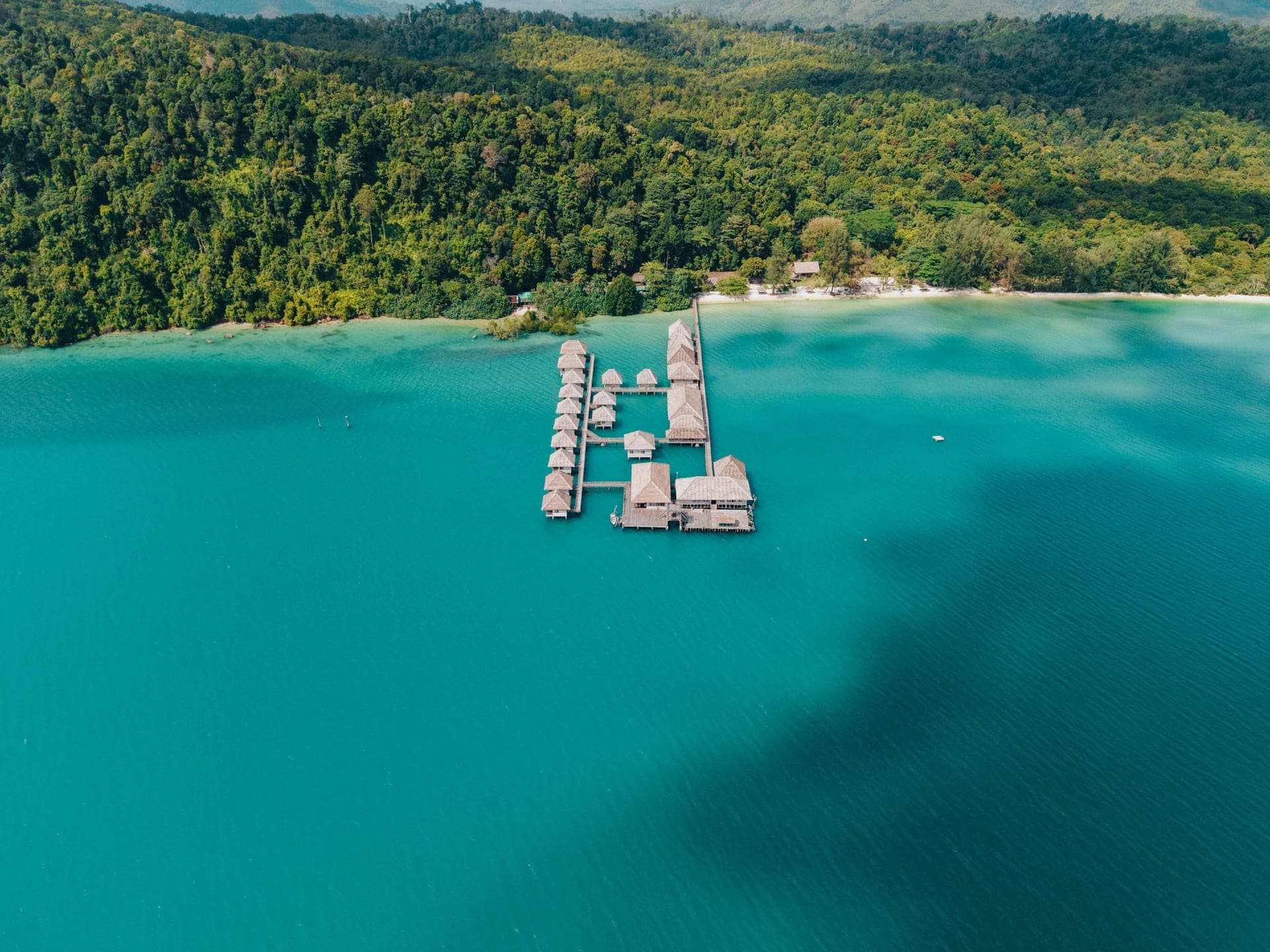 Aerial view of the overwater bungalows at Telunas Beach Resort