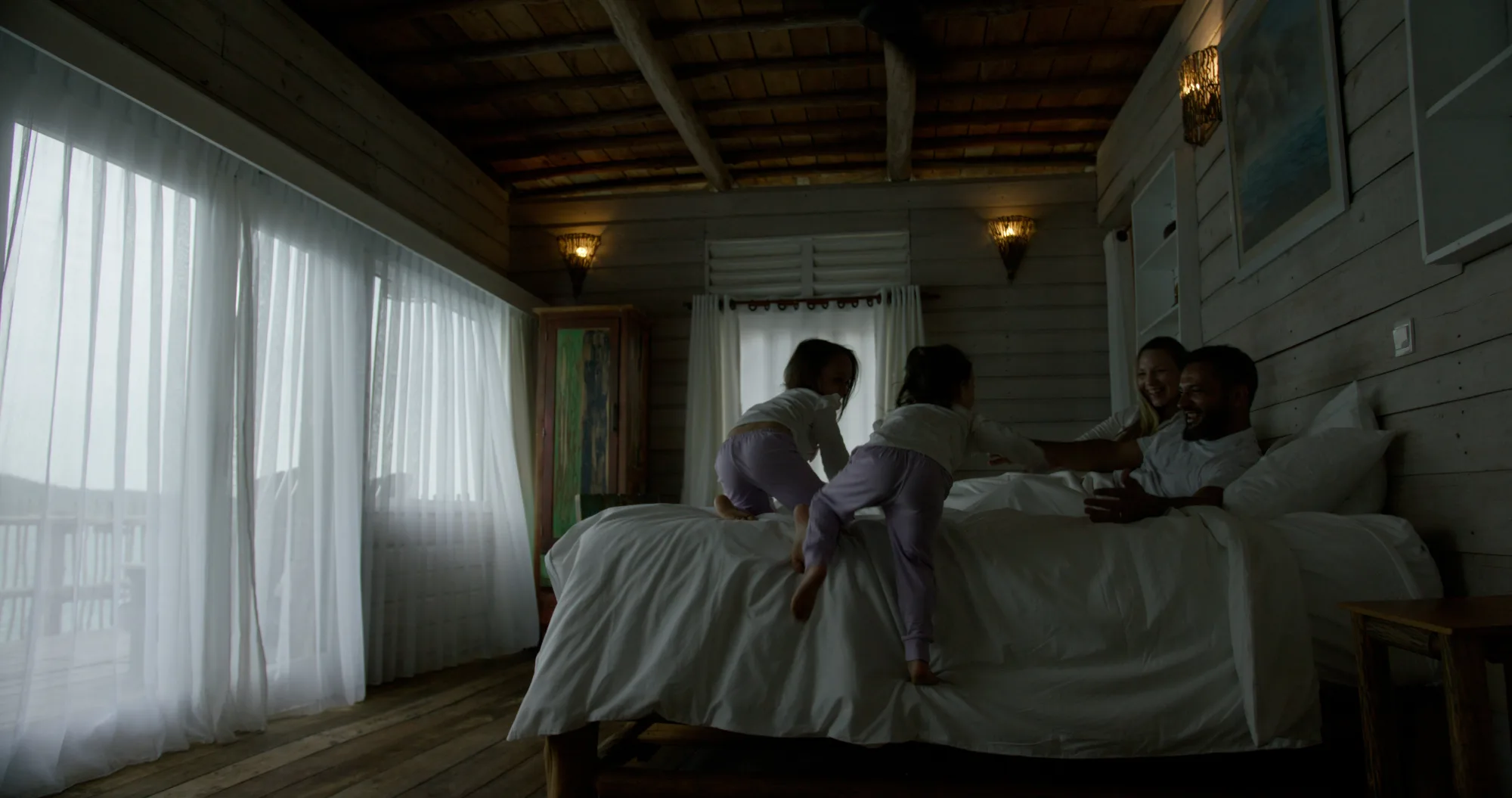 Family inside an Overwater Villa at Telunas Private Island