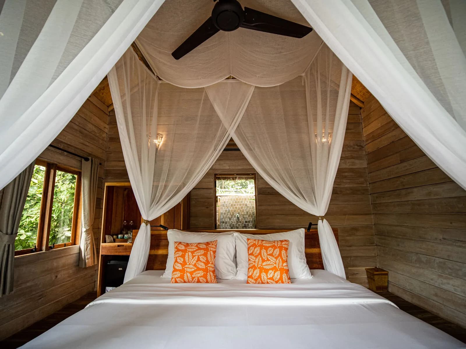 Air-conditioned king bedroom inside a Ridge Villa at Telunas Private Island